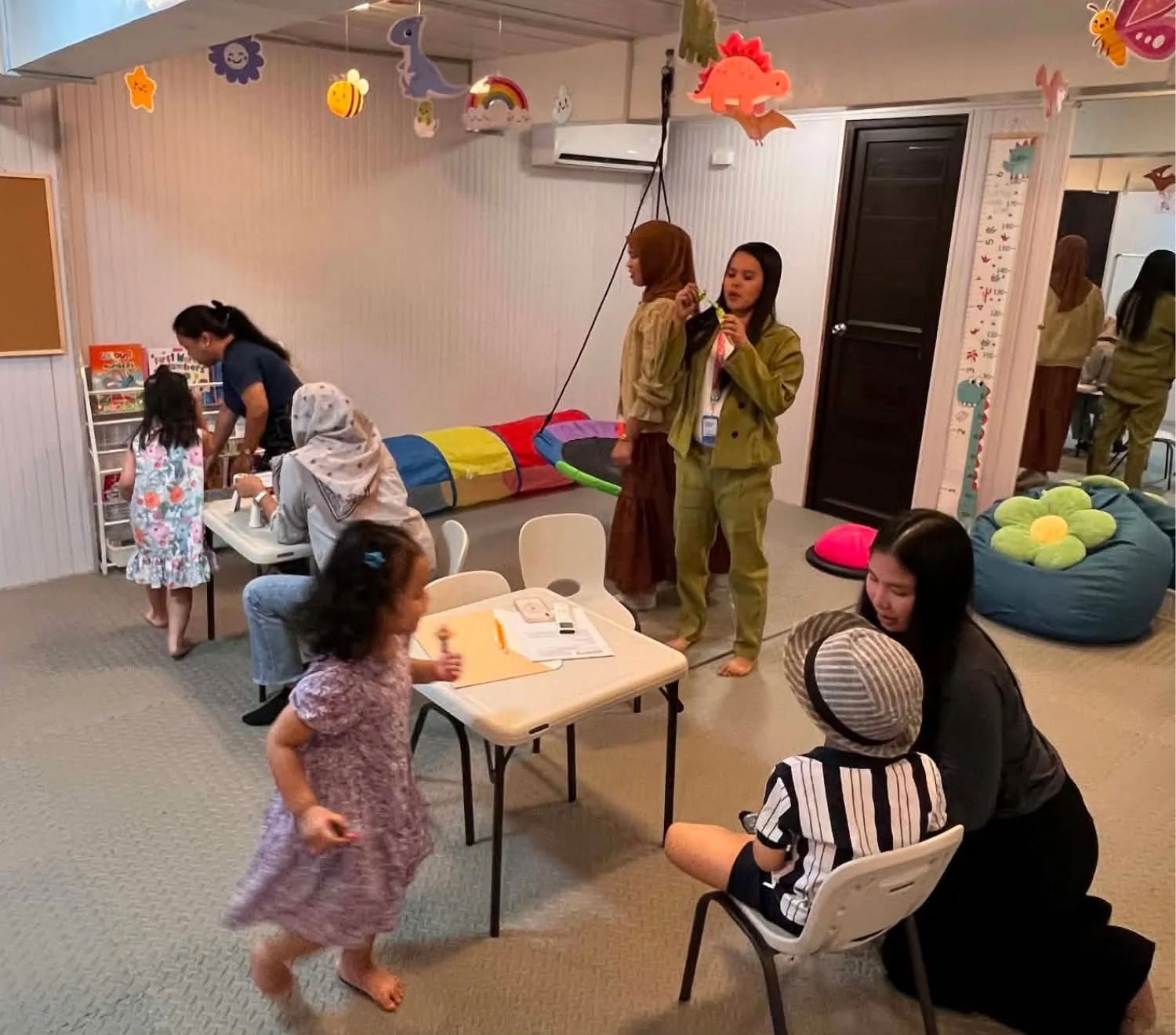 Inside the Little BLOOM therapy room, decorated and full of families